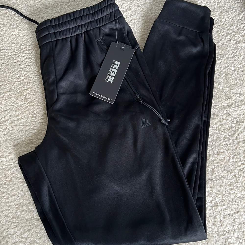 Mens Reebok soccer pants. New size small.